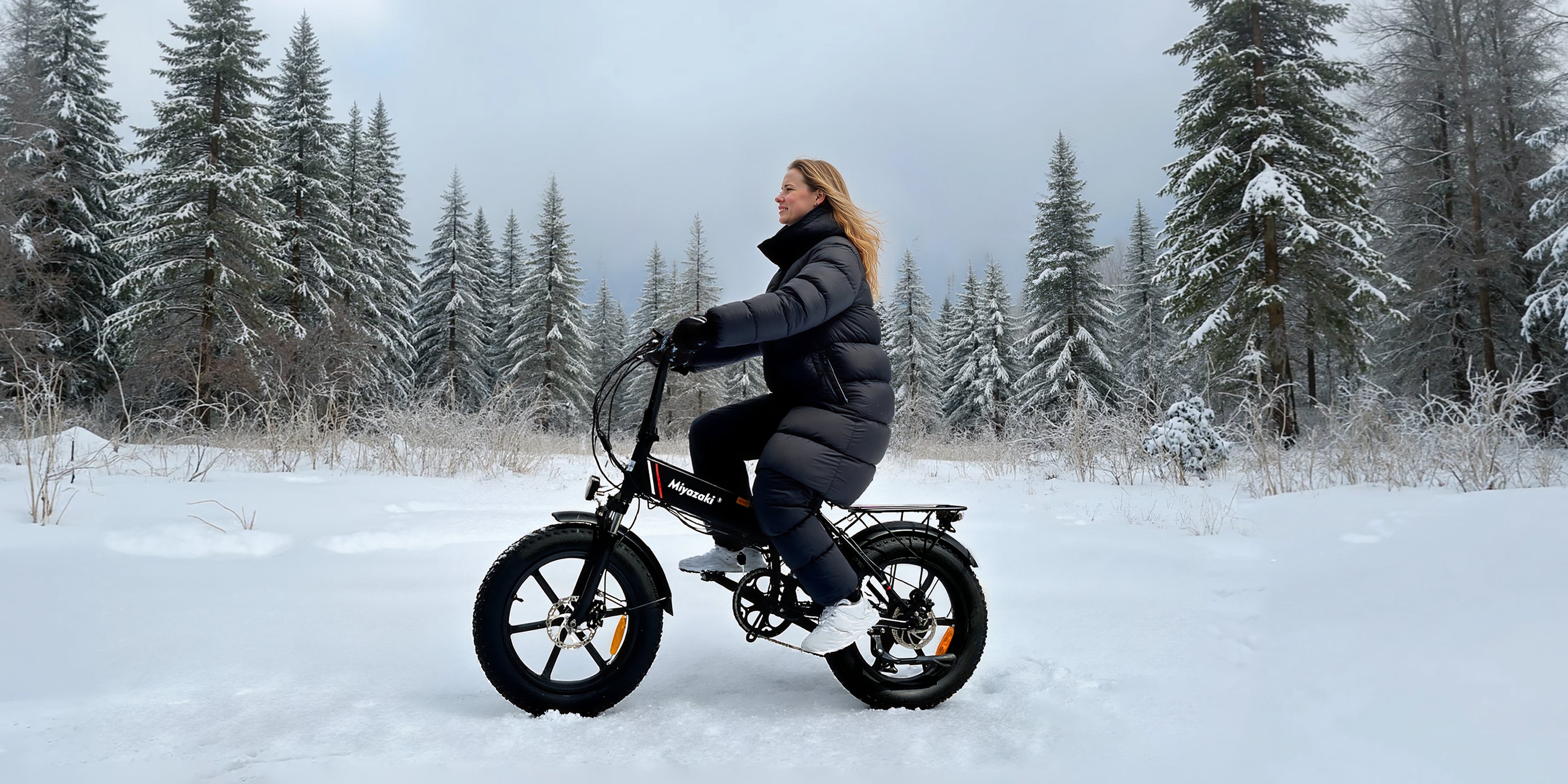 R5 fat-tire electric bike handling snow-covered forests with robust frame and anti-slip traction